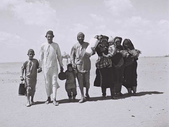 A Yemenite family walking through the desert to a reception camp set up by the American Joint Distribution Committee near Aden